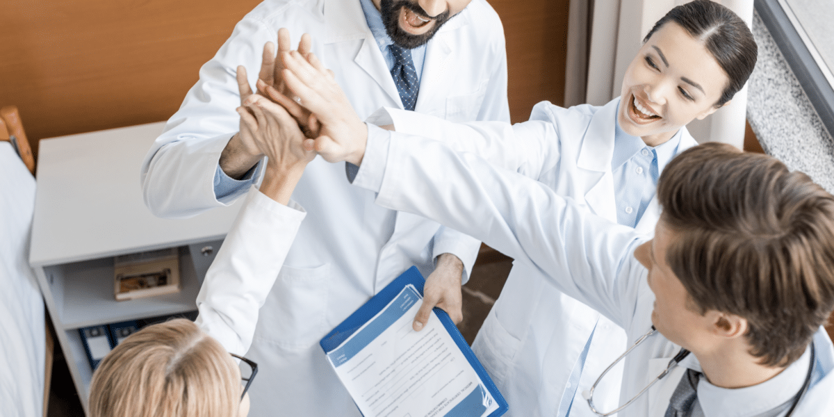 Doctors group high-five